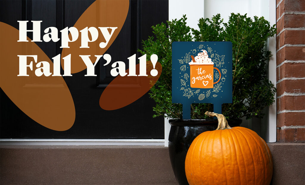 Thanksgiving decorated front door with pumpkin and potted plant. Autumn season.